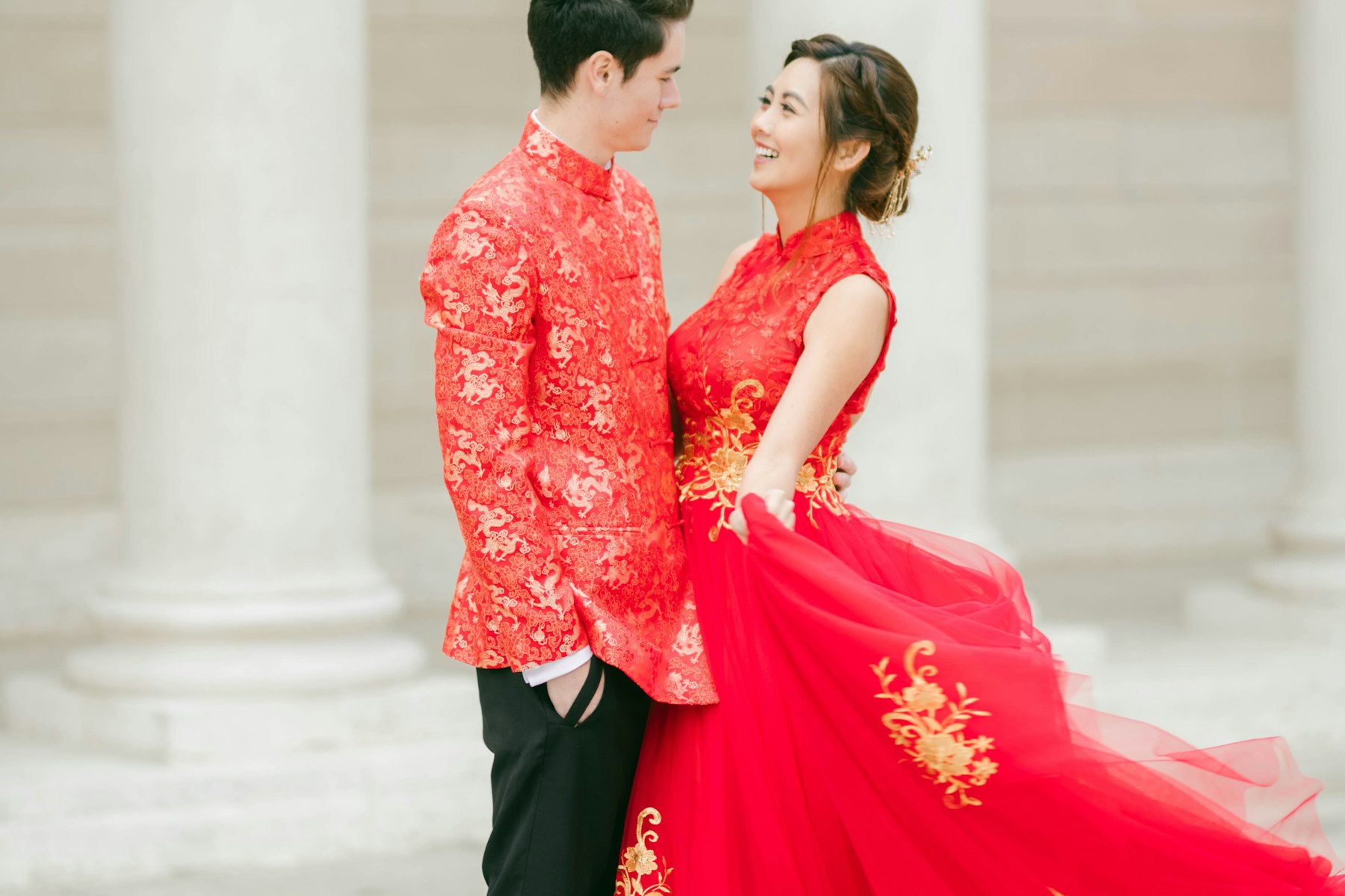 Chinese wedding couple in traditional red ceremonial attire